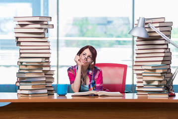 Young female student preparing for exams