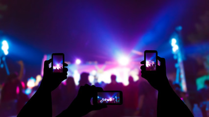 Take photo in front of concert stage