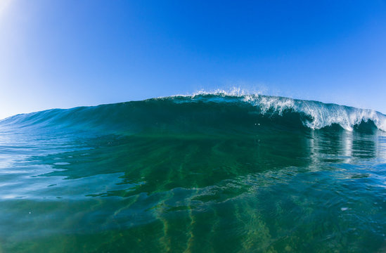 Fototapeta Wave swimming inside ocean blue water  closeup photo