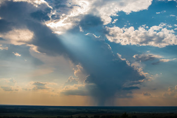 rain and clouds over the field