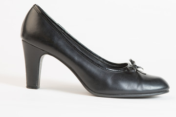 Used Black high heel shoe on white