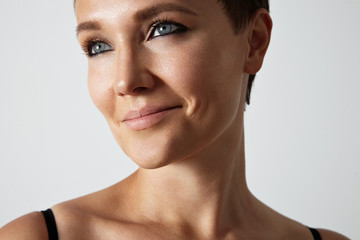 beauty young woman with a blue eyes and black smokey makeup