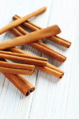 Cinnamon on a blue wooden background