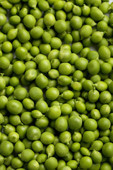 Fresh green peas background, close up