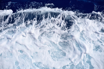 Restless foamy blue sea water from above - 114932786