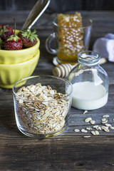 Cereals,fruit,milk and honey for breakfast