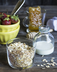 Cereals,fruit,milk and honey for breakfast