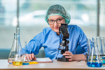 Experienced lab assistant working on chemical solutions