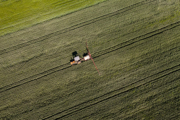 aerial view of the tractor on harvest field