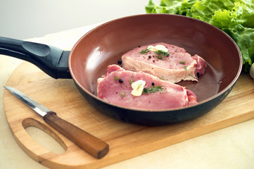  pieces of meat in n a frying pan