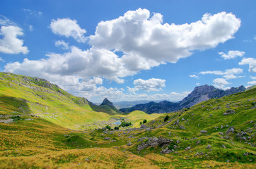 Obraz premium Montenegro, national park Durmitor, mountains and clouds. Sunlight lanscape.