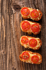 Grilled toast with cheese and tomatoes