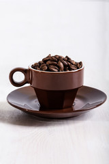 Coffee seed in brown cup