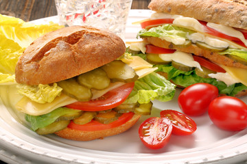 Fresh vegetarian sandwiches with tomato and cucumber on the plat