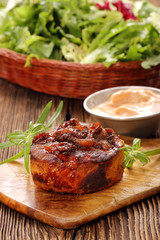 Smoky grilled hot chop on wooden background
