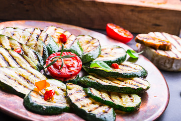 Grilled Zucchini Tomato with chili pepper.  Italian mediterranean or greek cuisine. Vegan vegetarian  food.