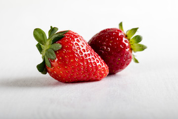 Two juicy strawberry on the table