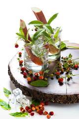 refreshing summer drinks in glass with ice and mint on a white background.