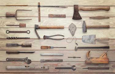 Old tools on wooden table. Traditional handmade tools for craftsmen.