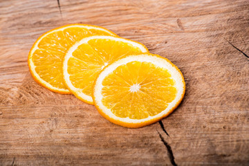 Orange slices on wooden board