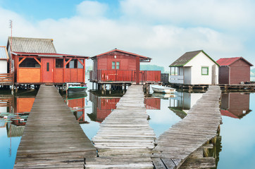 Old colorful fishing huts at lake Bokodi, Hungary.
