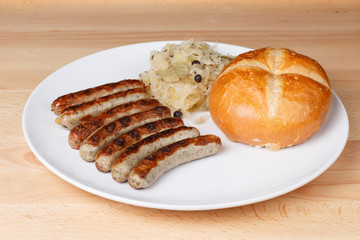 Authentic sausages from Nuremberg Bavaria with Sauerkraut and Roll