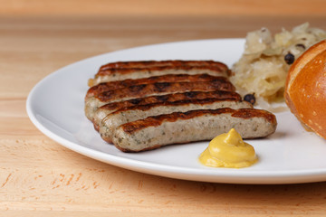 Authentic sausages from Nuremberg Bavaria with Sauerkraut and Roll