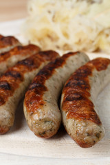 Authentic sausages from Nuremberg Bavaria with Sauerkraut and Roll