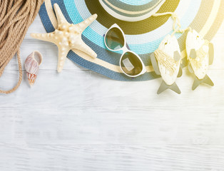 Beach accessories on wooden background