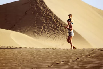 Poster Mom with sun in a desert © sashka_lenka
