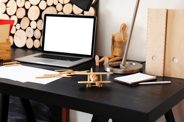 Naklejka premium Desktop of creative person with different items indoors
