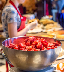 Frozen strawberries in stainless steel bowl