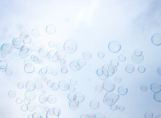 Fototapeta na wymiar Soap bubbles on sky background