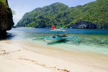 El Nido, Philippines - banca on the beach, Tapiutan island