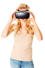 Happy woman wearing virtual reality goggles