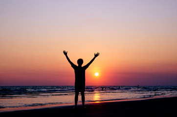 Fototapeta premium Silhouette man show his hands up