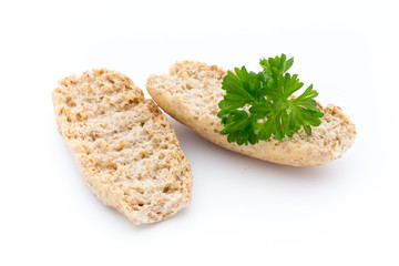 Dry flat bread crisps with herbs on a white background.