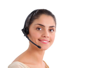 Portrait of beautiful business woman working at her desk with headset and laptop