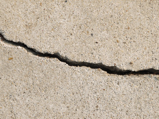 Fototapeta na wymiar Cracked concrete texture closeup background
