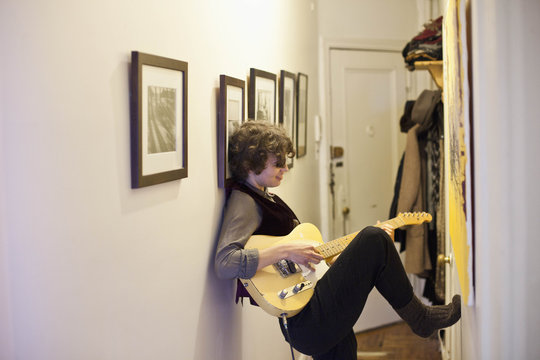 Young woman playing a guitar