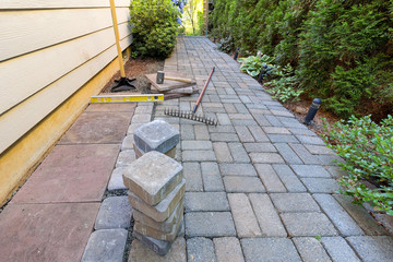 Stone Pavers and Tools for Side Yard Landscaping - 114954783