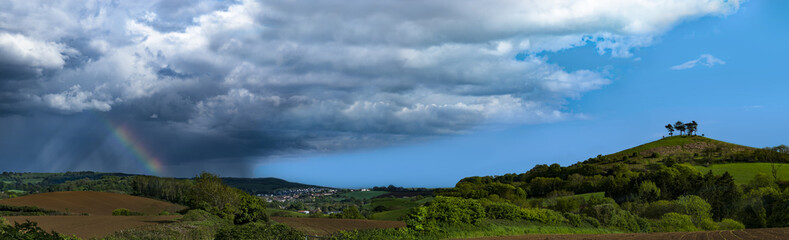 Fototapeta na wymiar Panoramic of rainbow and Colmer's Hill, Dorset