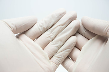disposable sterile white gloves on white background