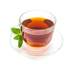 Transparent Cup of black tea with mint leaves On white background