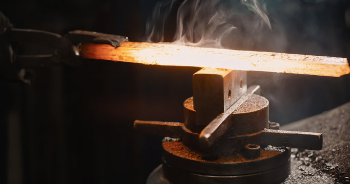 Rod hot iron on the anvil.