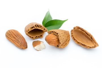 Almonds with leaves isolated on white background