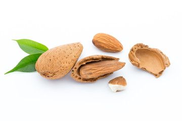 Almonds with leaves isolated on white background
