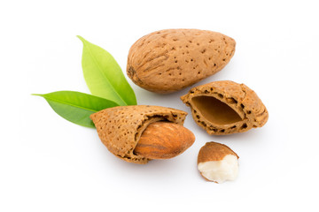 Almonds with leaves isolated on white background