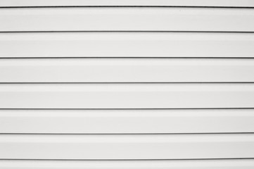 The texture of the siding, horizontal stripes, a black and white image.