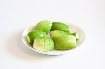 Cucumbers, vegetables, white dish.